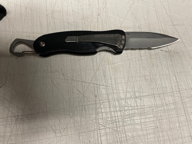 Leatherman Knife with 3 inch serrated blade with carrying case and belt loop