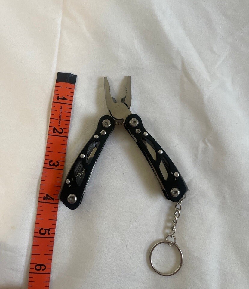 Pocket Size Multitool with Spring-Action Pliers and Saw,