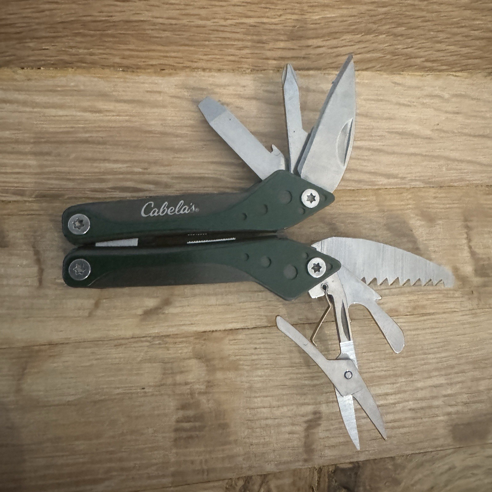 Cabela’s 7 Tool Multi-Tool with Sheath Spring Open Pliers Scissors Saw Green