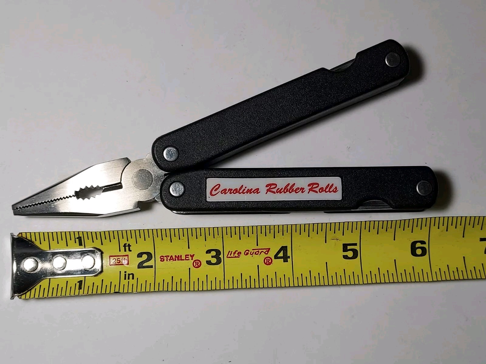 Pliers Multi Tool advertising Carolina Rubber Rolls with nylon pouch