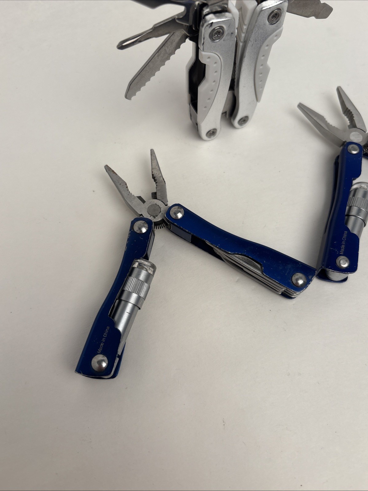 Lot Of 4 Different Function Multi-Tools Winchester Nail Clipper & Wood Grain