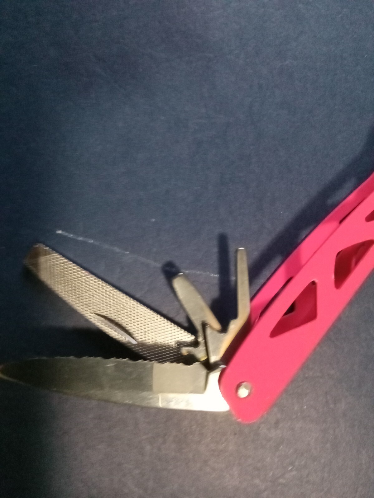Pink 19-in-1, Multi Tool with pliers, knives, screwdrivers, bottle opener, etc