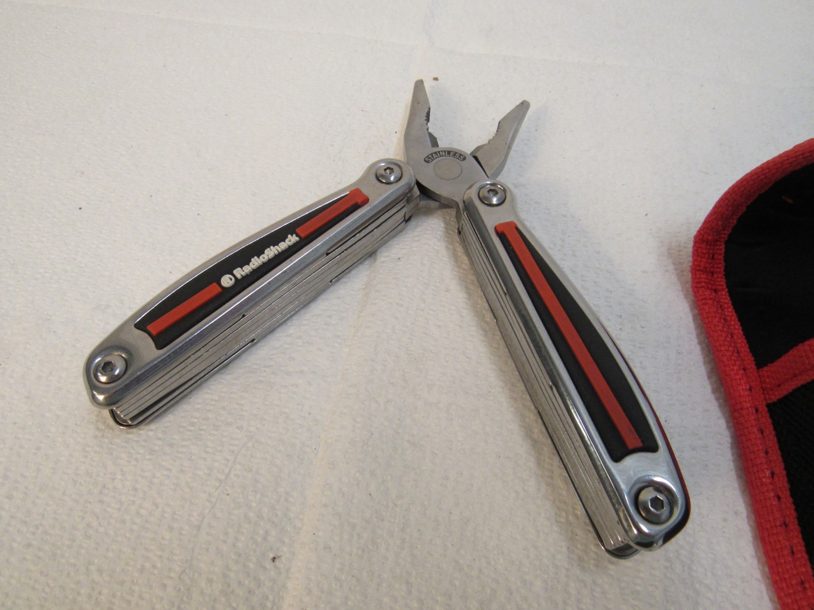 Radio Shack Multi-Tool Stainless Steel With Belt Case Red, Black, Stainless