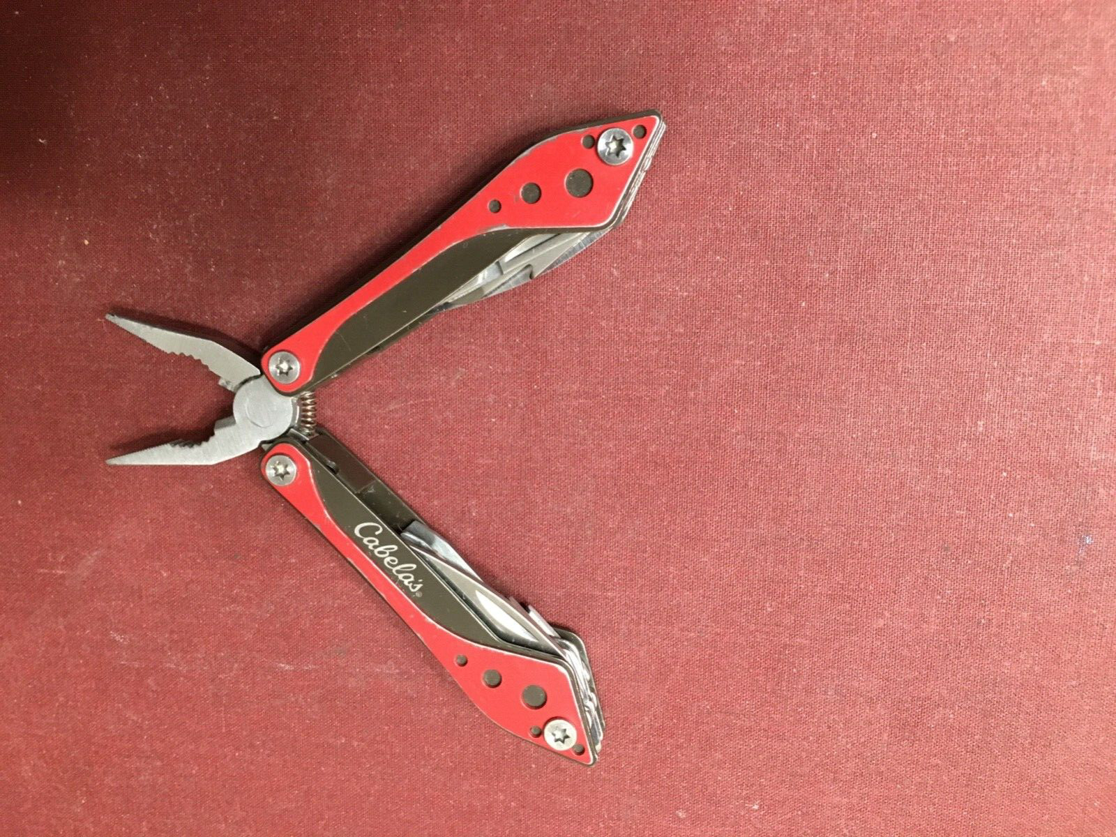 Cabela’s 4-1/2″ Multi-Tool in Red and Black with 7 Tools In One