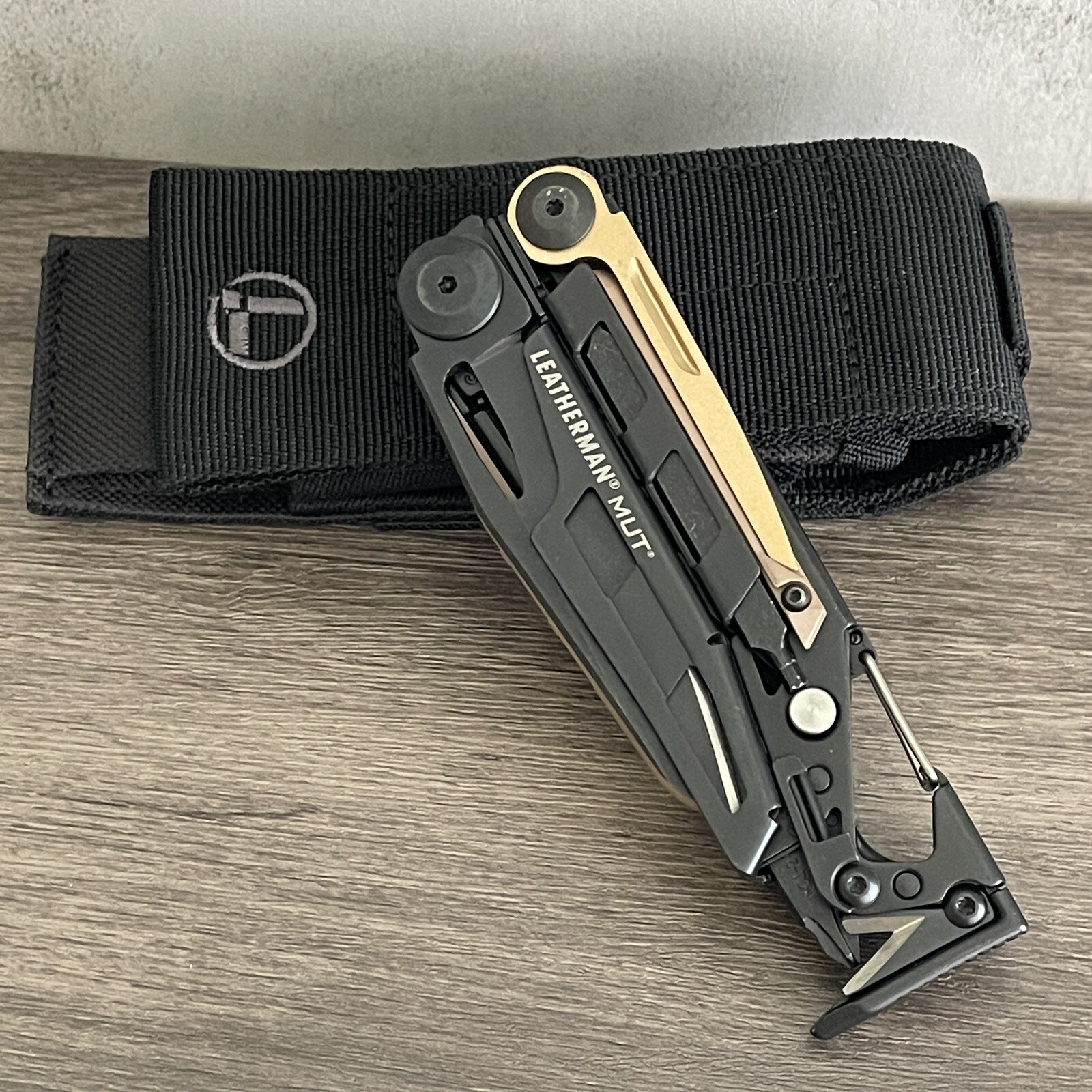 Leatherman MUT EOD Black multi tool with Brown/Tan Inserts. Discontinued Variant