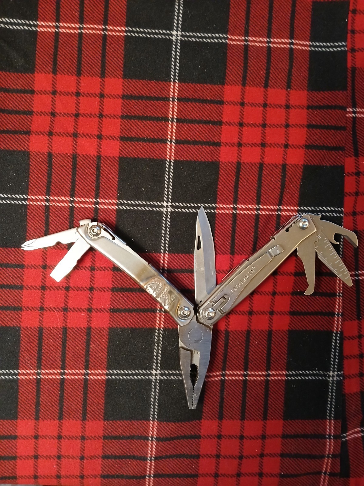 Leatherman Rev Multi-Tool with MO Welded on the surface