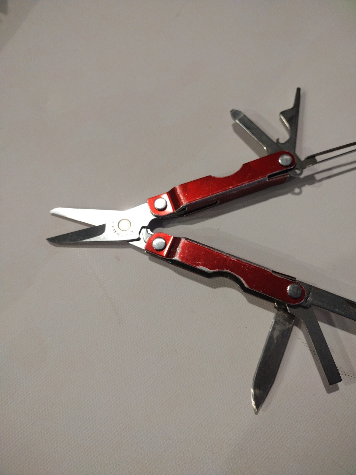 Leatherman Micra Multi-Tool, Knife, Scissors, Key Ring, Red Color in Good Condit