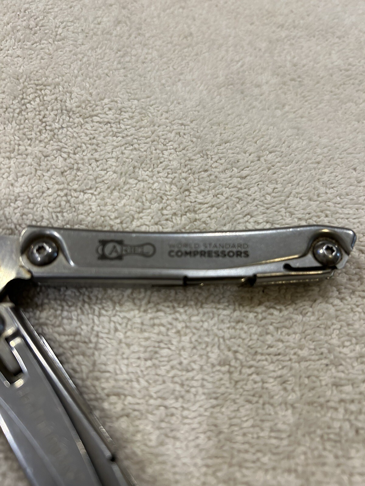 Leatherman Rev multitool with company logo