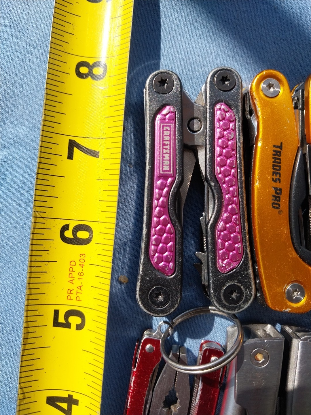 4 multi tools with pliers knives screwdrivers saw