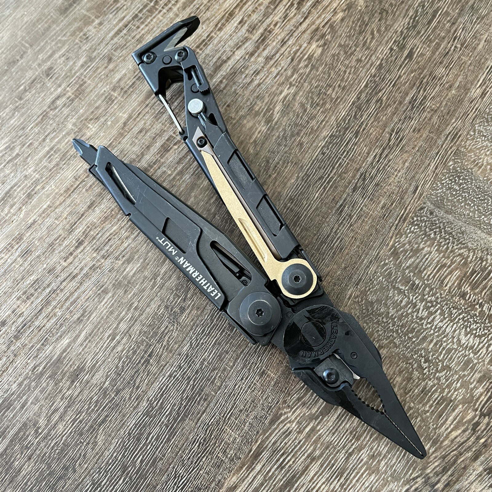Leatherman MUT Black multi tool, brown molle sheath. Brand new