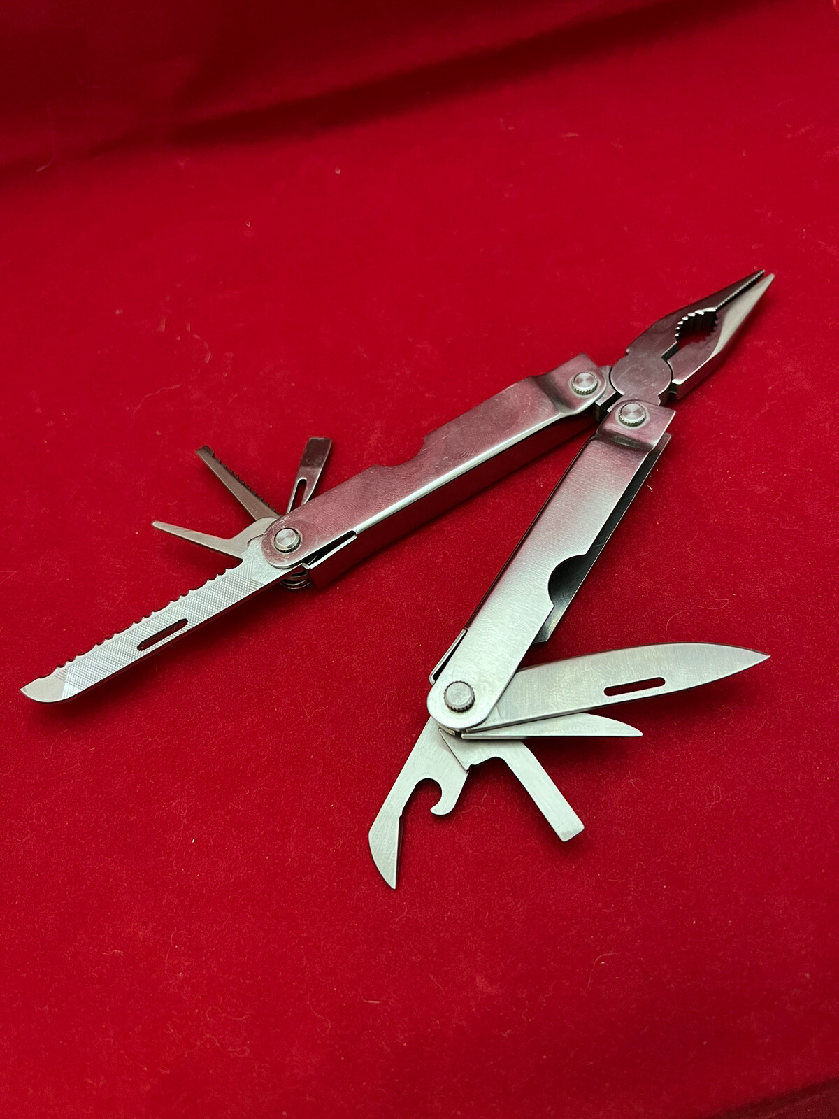 Stainless Steel 12-in-1 Multi-Tool – Pliers Knives Screwdrivers File Saw Opener