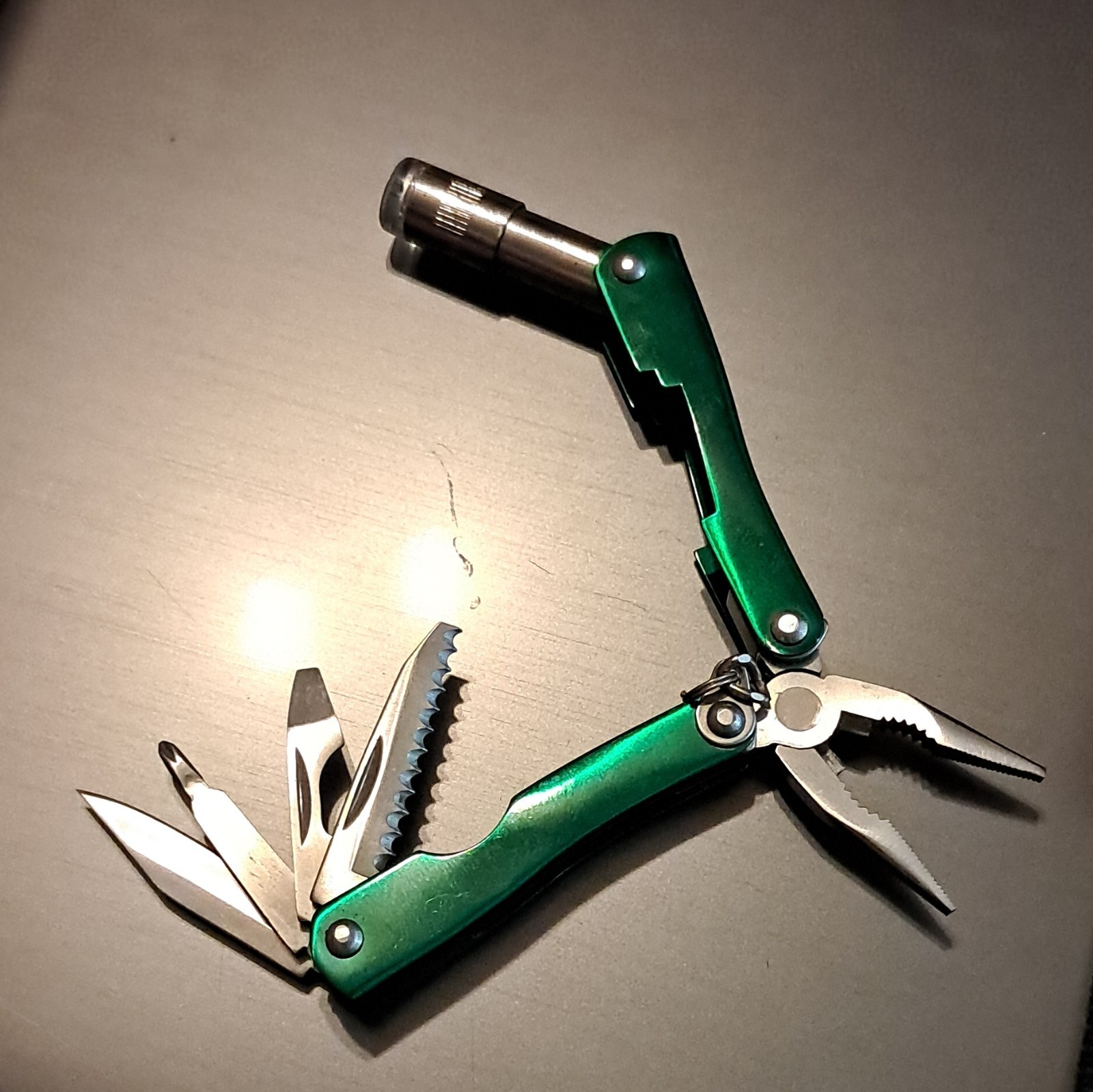 Cabela’s Green/Silver 6-in-1 Multi-Tool Pliers, 2.25″ SS Blade w/ Sheath