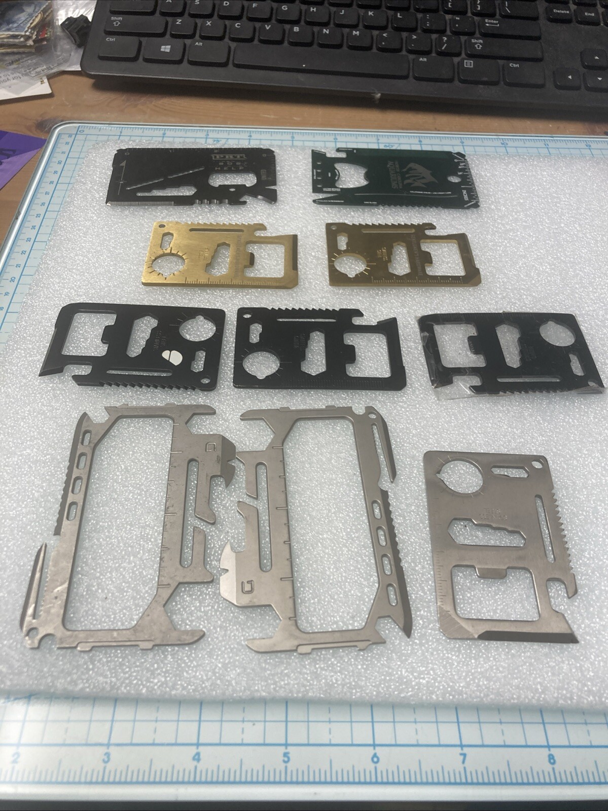 10 USED Various/Multicolor TSA Confiscated Metal Survival Wallet Cards. A STEEL!
