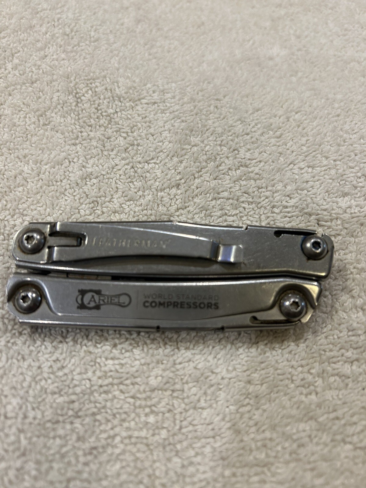 Leatherman Rev multitool with company logo