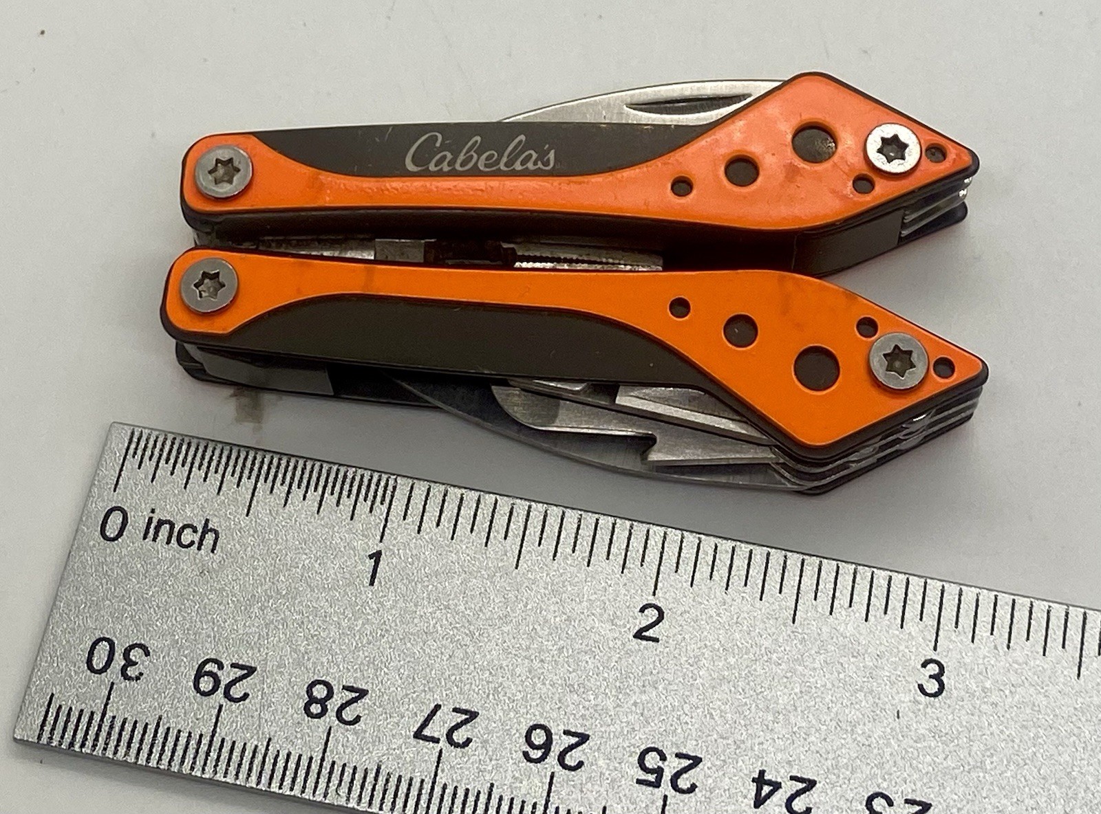Cabela’s Multi-Tool 7 Tools in 1 Orange Knife Pliers Stainless Steel Black Case