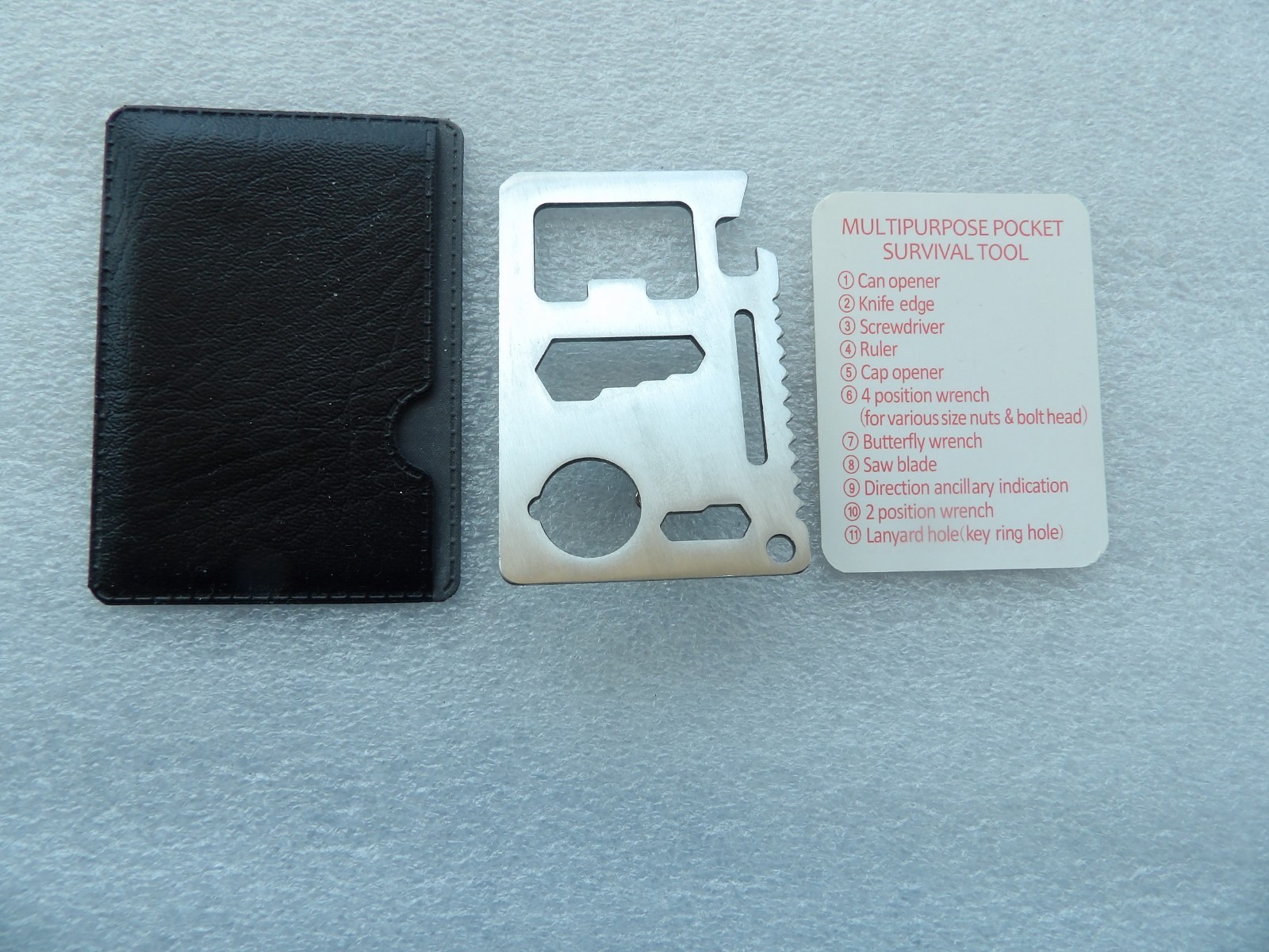 Wallet-sized stainless steel multi-tool with 11 different functional features