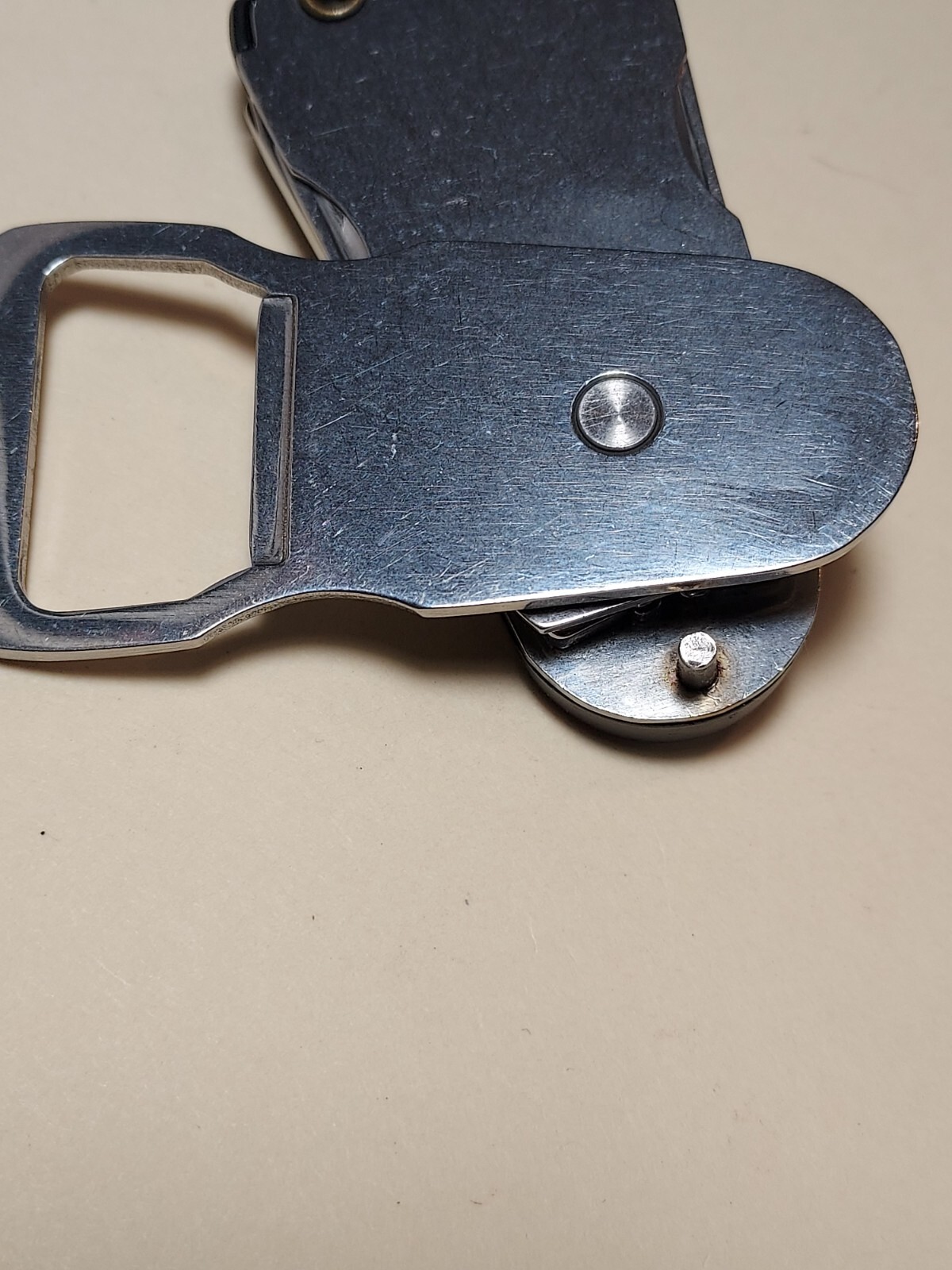 Swiss+Tech Swivel Tool 8-in-1 bottle opener multi tool with light
