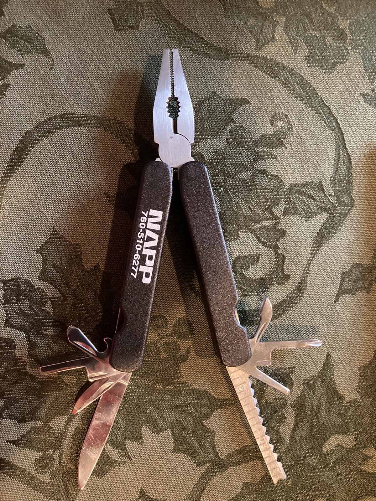 Plier Multi Tool with knife, screwdrivers, can opener, bottle opener, etc.