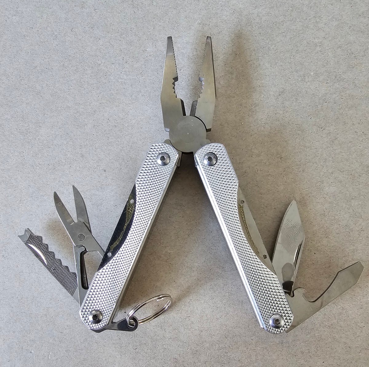 Pocket Multi-Tool with 9 Tools – Pliers Cutters Opener Flat Head Scissors Knife