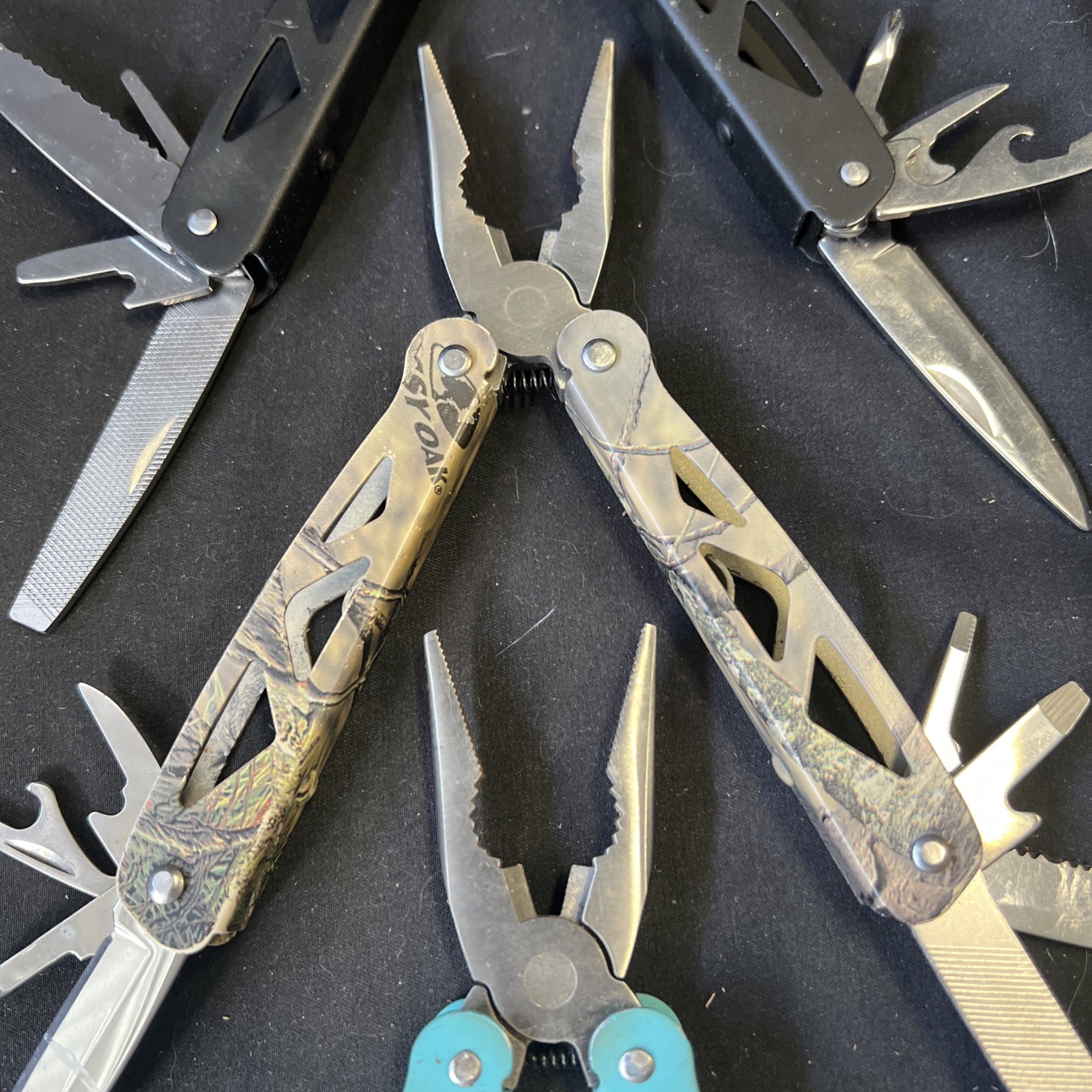 Set Of 3 Ozark Trail Trailside 12-in-1 Multitool – Black, Teal, & Camouflage