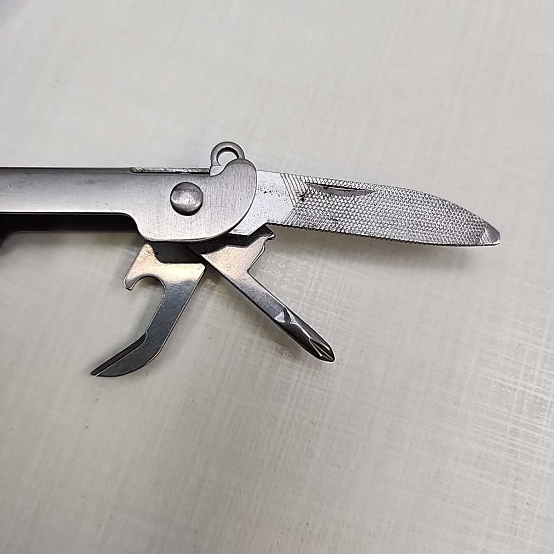 Pocket multi tool unbranded, plier, knife, file, screw drivers, awl, can opener
