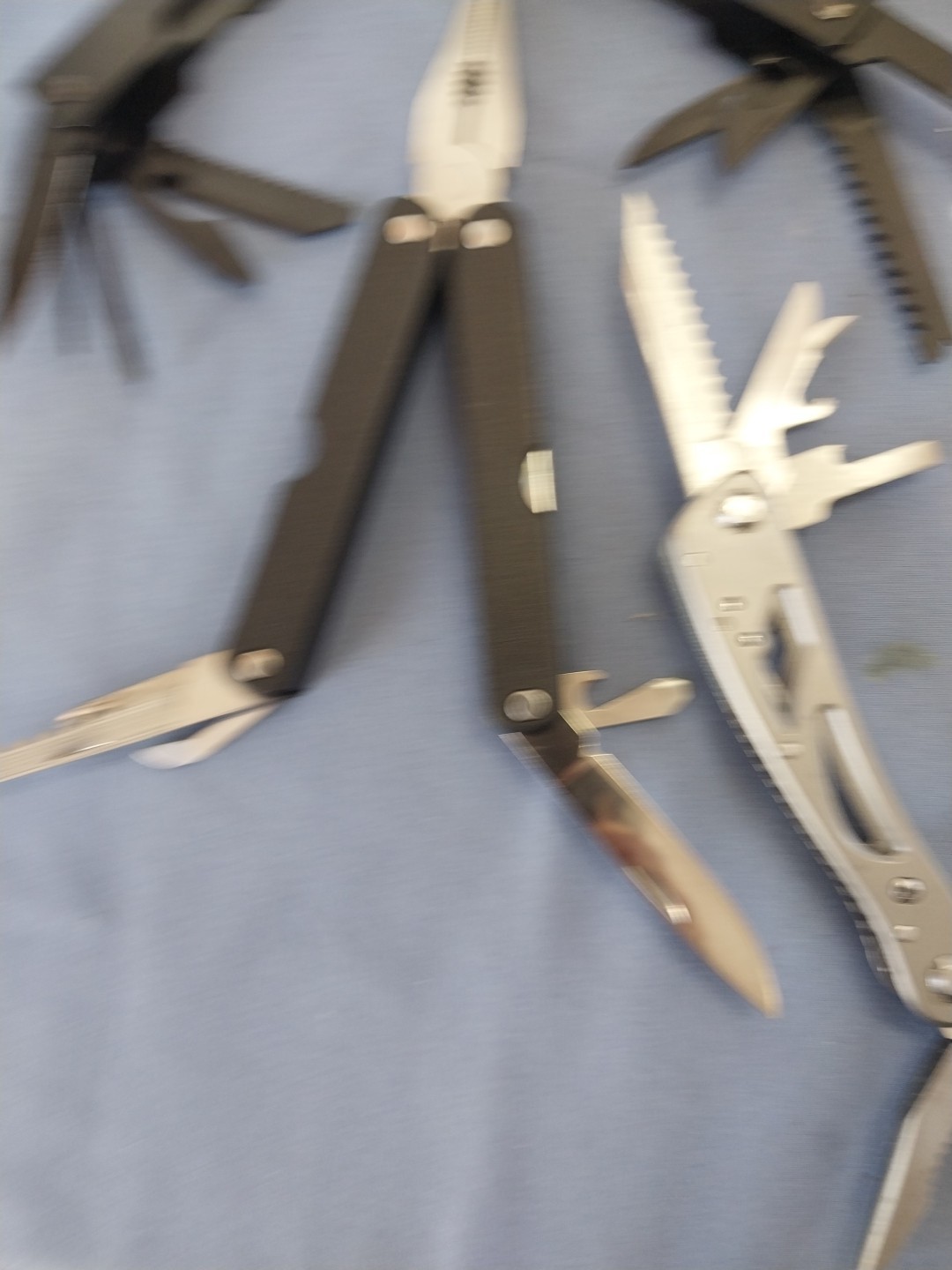 4 multi tools pliers screwdriver knife saw