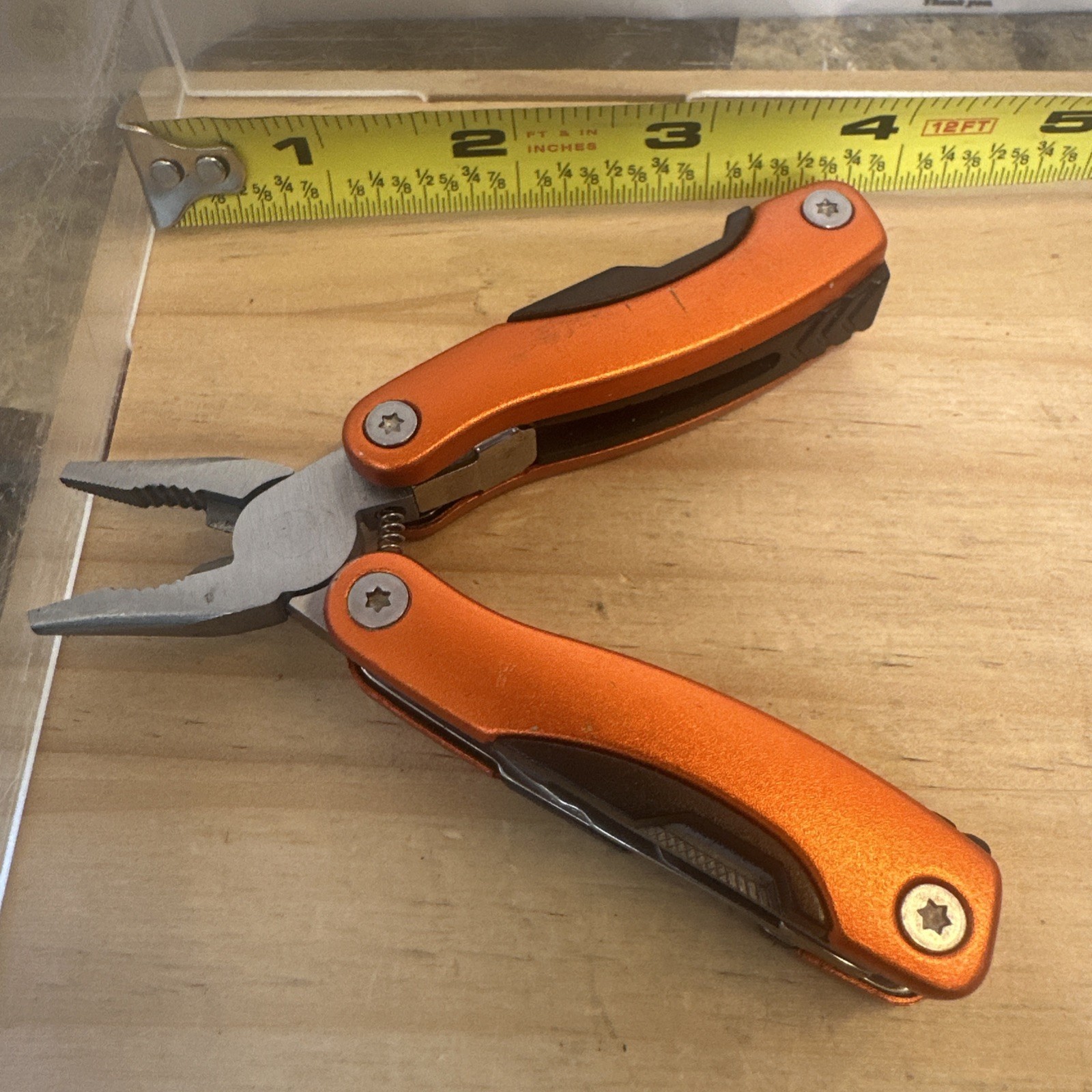portable pocket multi-tool featuring spring-action pliers 2.75” Closed