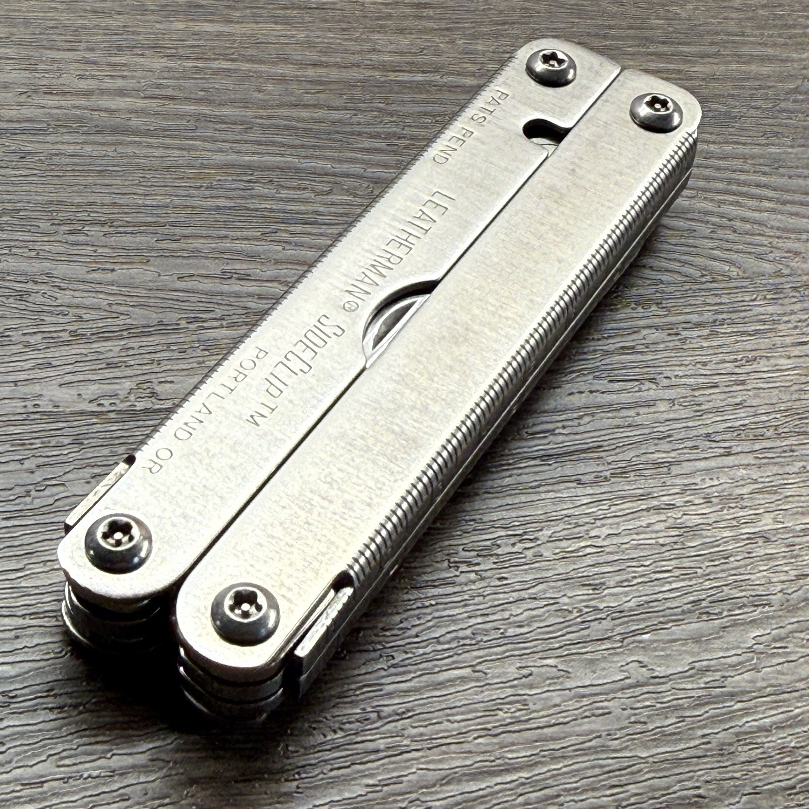 Leatherman Sideclip multitool. Lightly used. Late Run: shiny factory polished