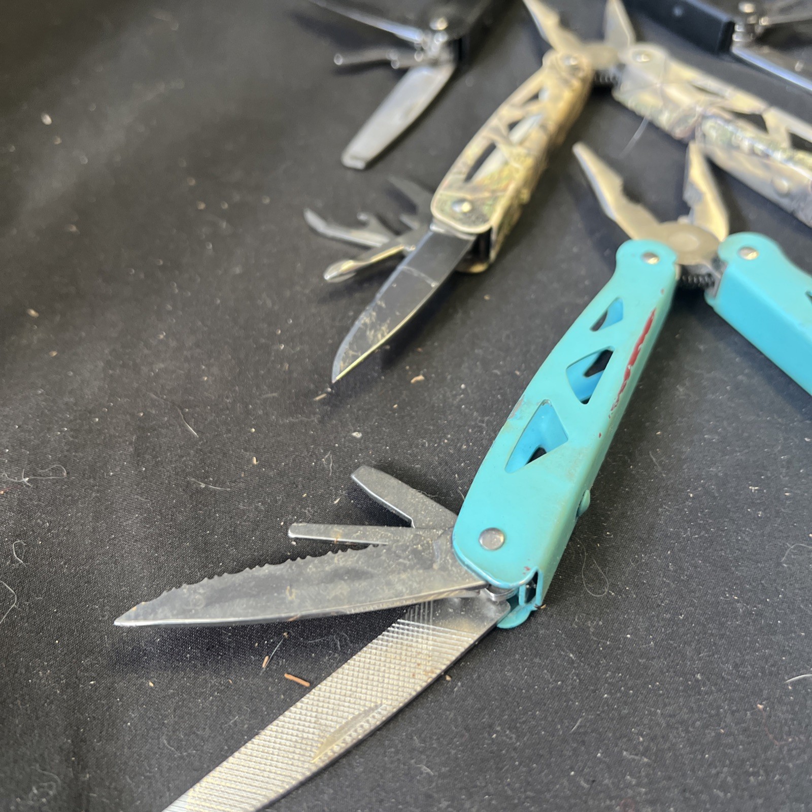 Set Of 3 Ozark Trail Trailside 12-in-1 Multitool – Black, Teal, & Camouflage
