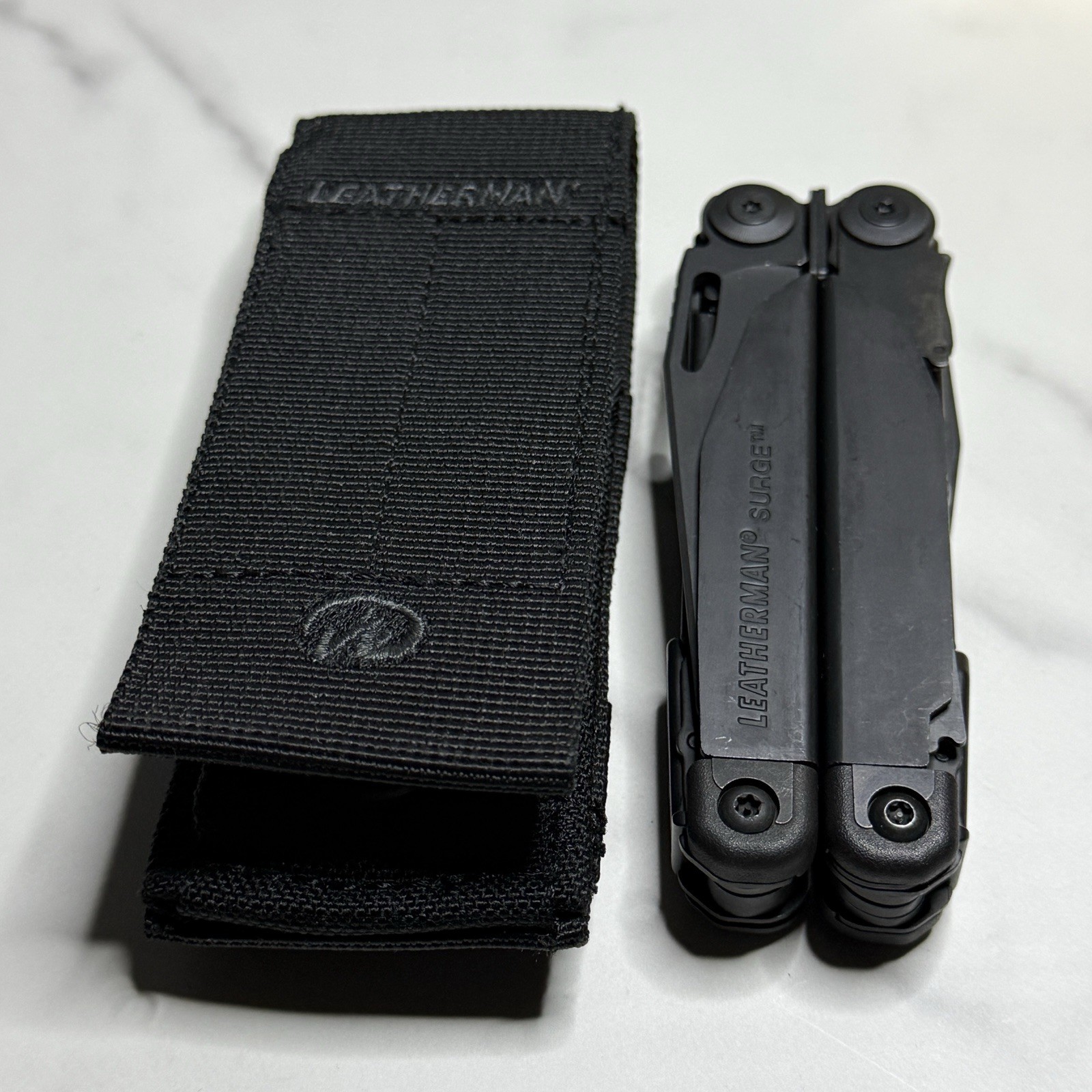 Leatherman Surge Cap Crimper Black Multitool w/Molle Sheath. Discontinued