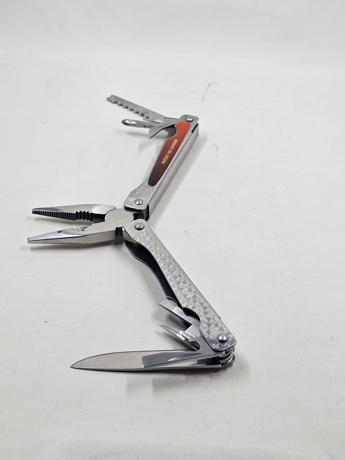 Sheffield No 1200E Stainless Steel Multi Tool Pliers Saw Knife Red Handle 4in