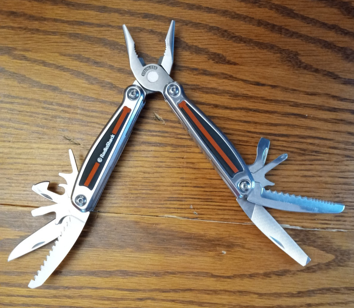 Radio Shack Stainless Steel Multi-Tool w/ 11 Tools. Pocket Knife. Rubber Grip