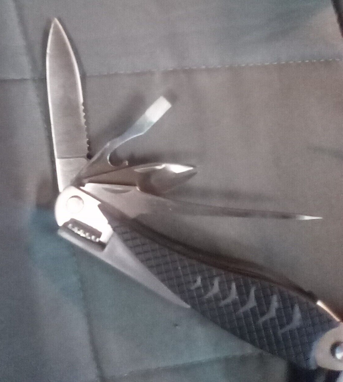 multitool 13 tools plus!!! Nice tool!!! With pouch not a branded item