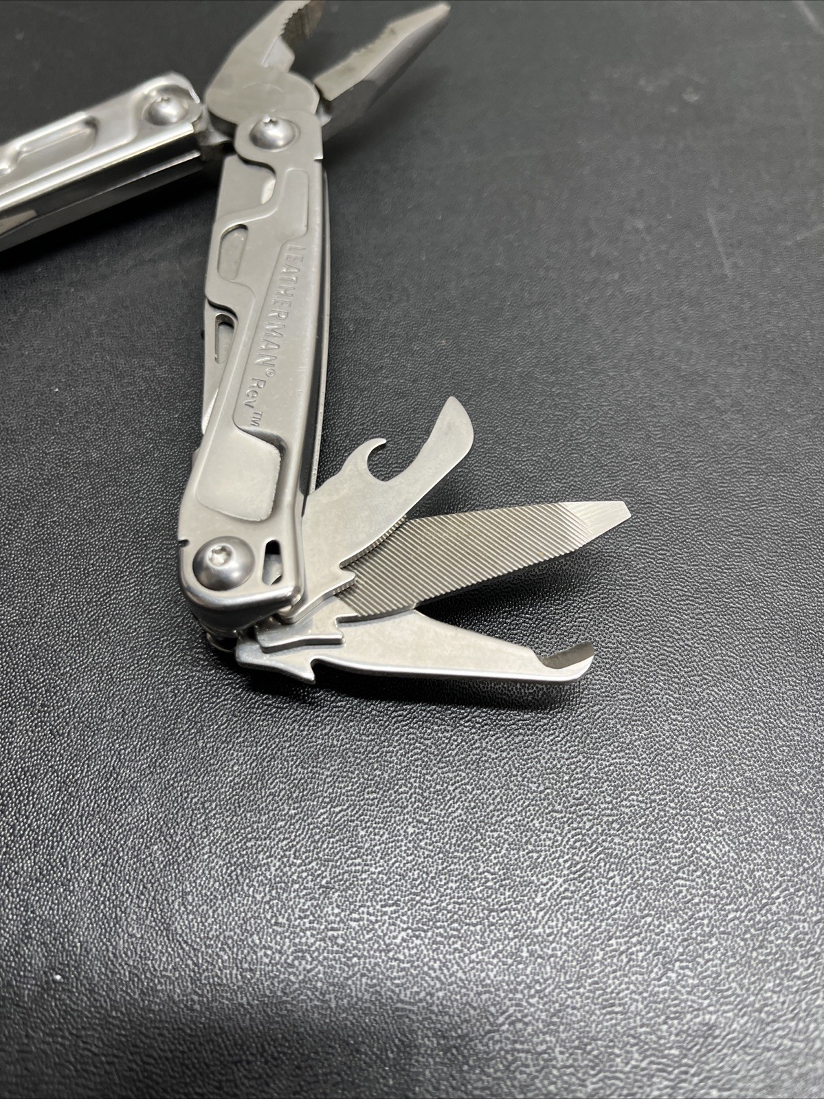 Leatherman Rev Pocket Size Carry-on Stainless Steel Multi-tool, & Engraved