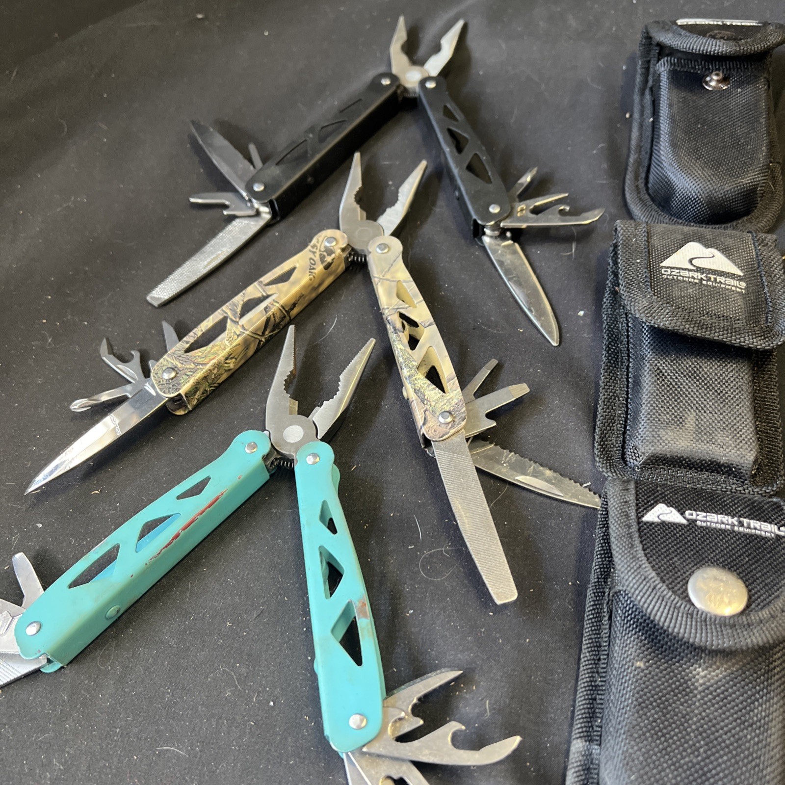 Set Of 3 Ozark Trail Trailside 12-in-1 Multitool – Black, Teal, & Camouflage