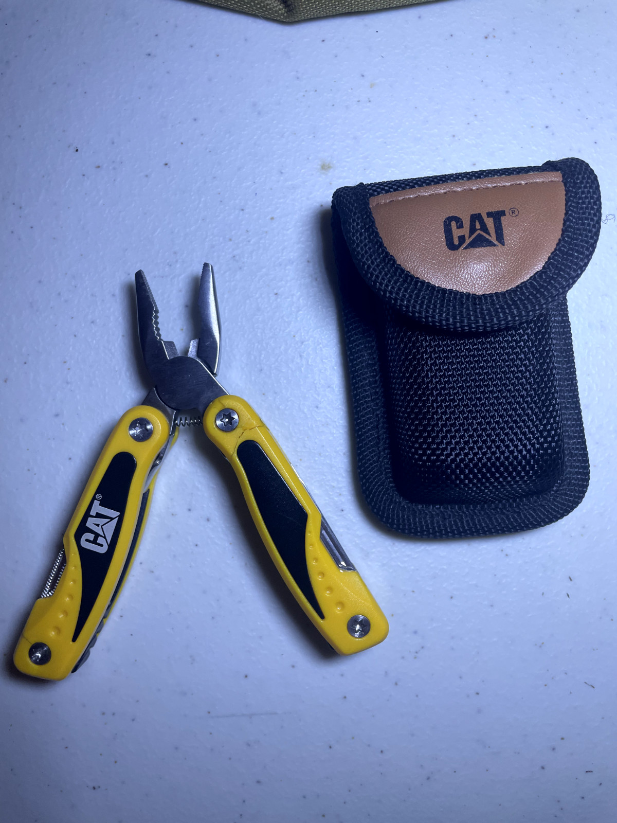 CAT Multitool cracked/chipped plastic
