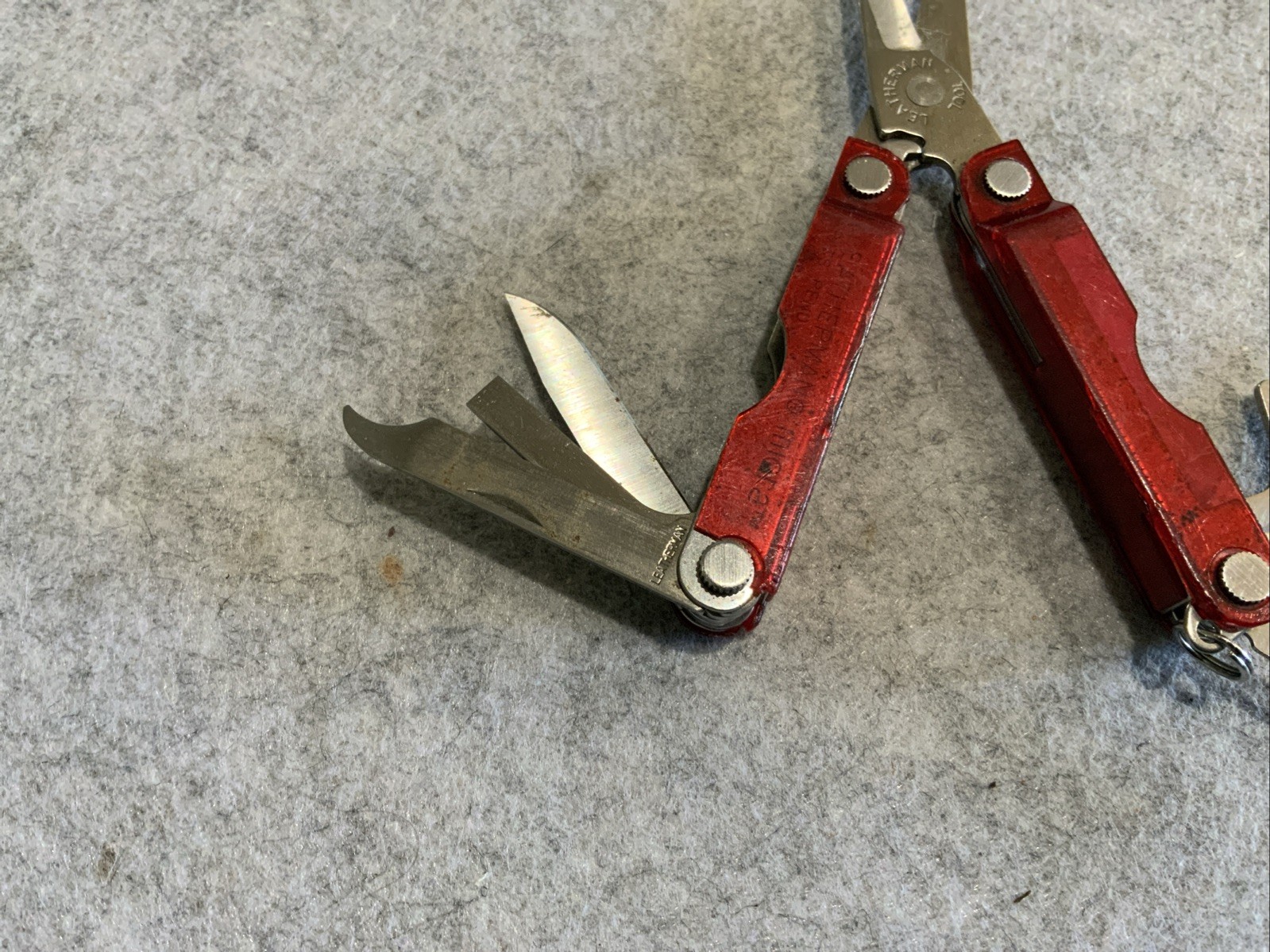 Leatherman Micra Multi Tool Red Transparent Plastic Coating Chipped