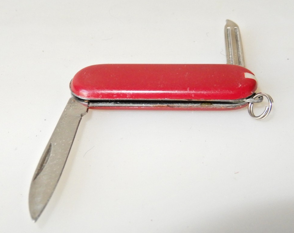 Unbranded Chinese Knock-Off red multitool, tweezers, toothpick
