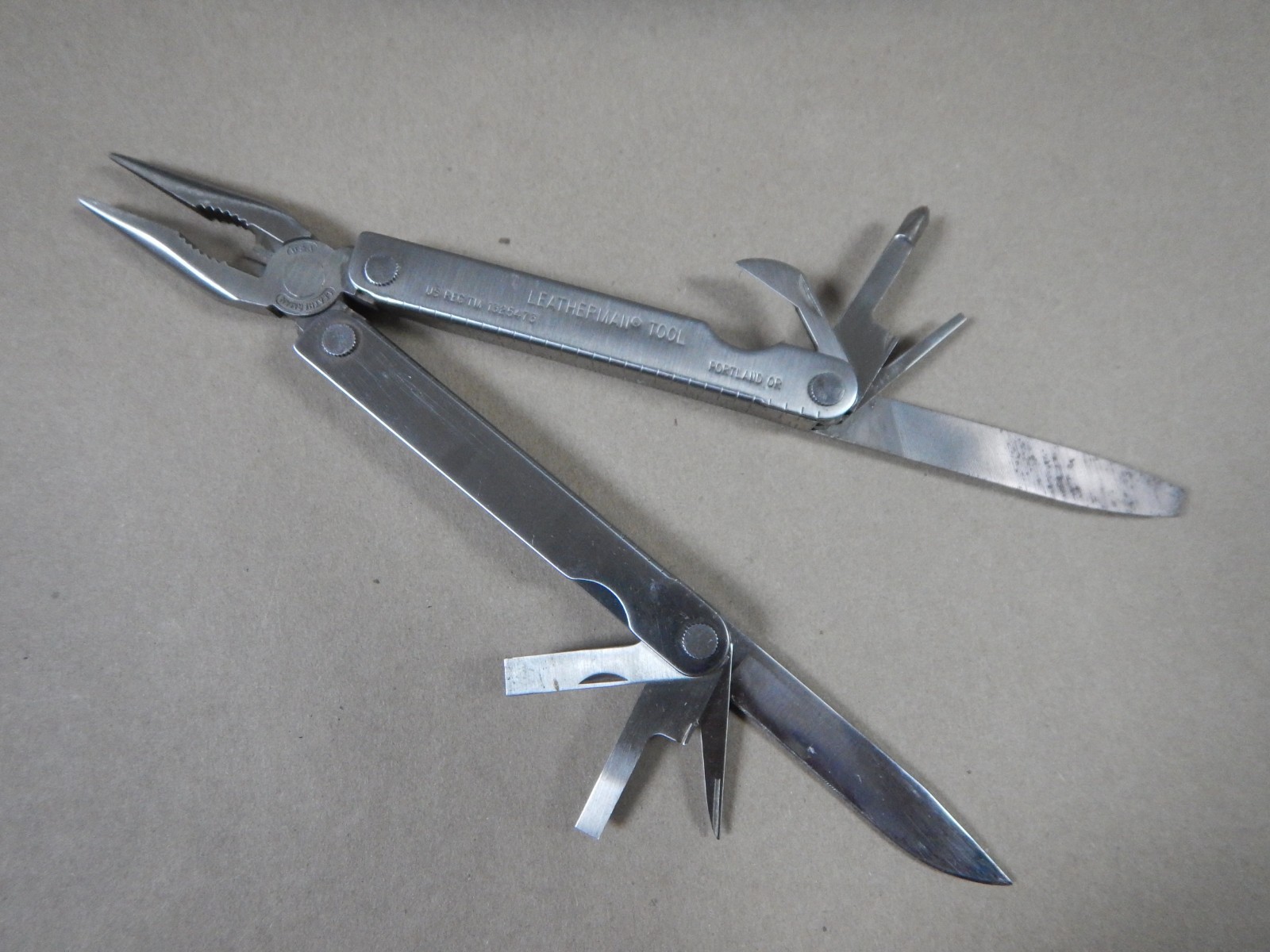 Original Leatherman Tool From The 90s with original leather sheath