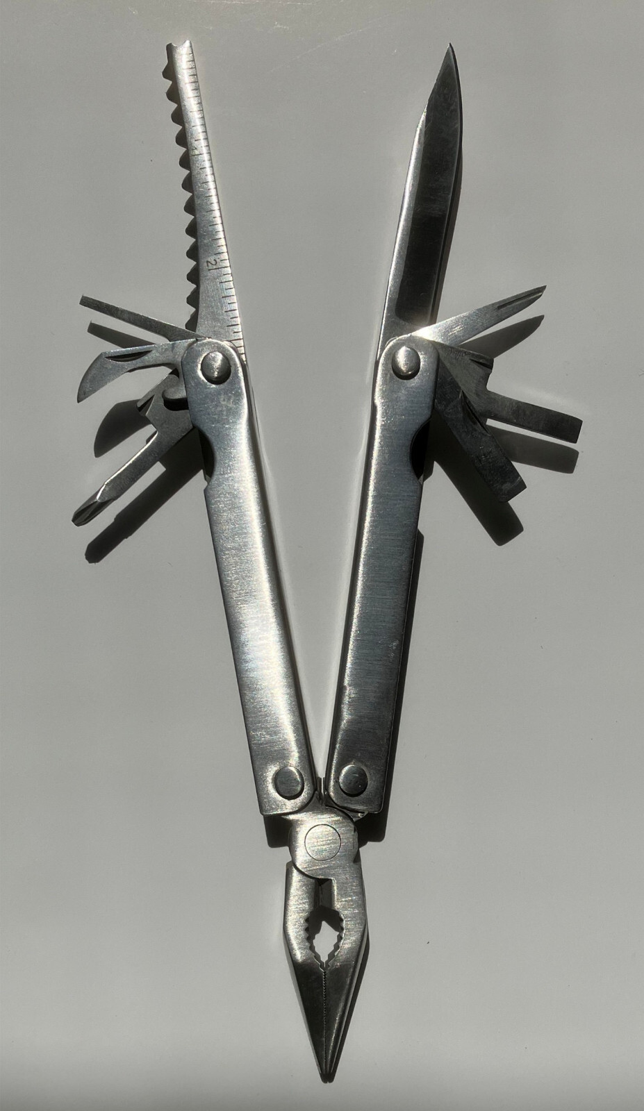 Multi tool Folding Pocket Tool featuring Pliers, wire cutter and 8 other tools