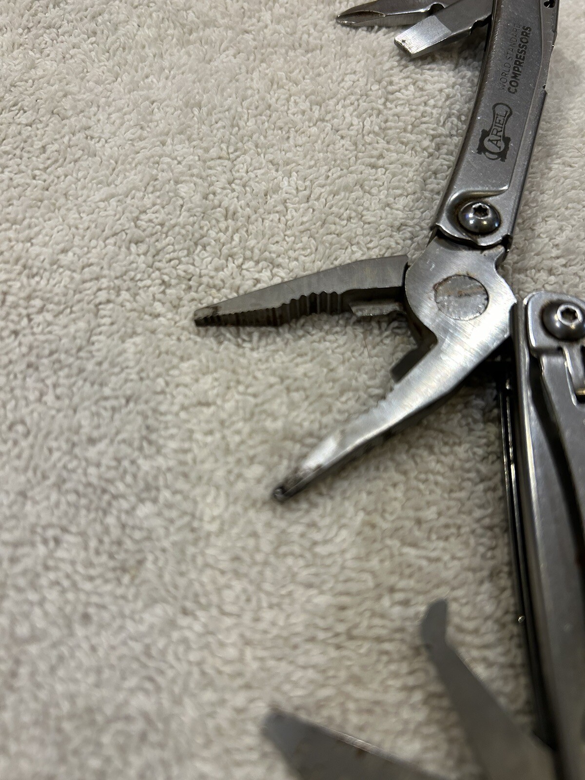 Leatherman Rev multitool with company logo