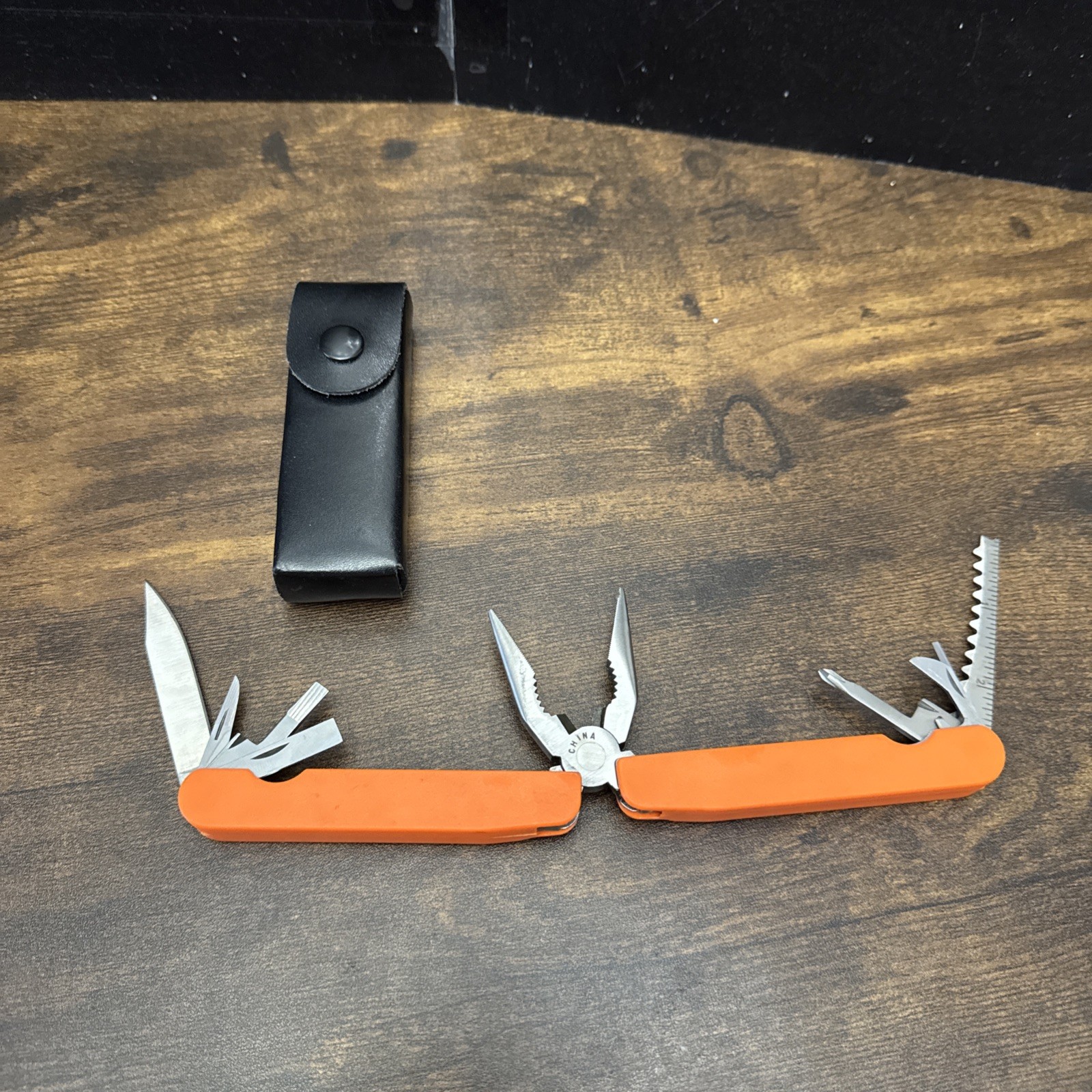 Orange Companion 10 in 1 Multi-Tool – Folding Pliers, Blades, Screwdrivers, Saw