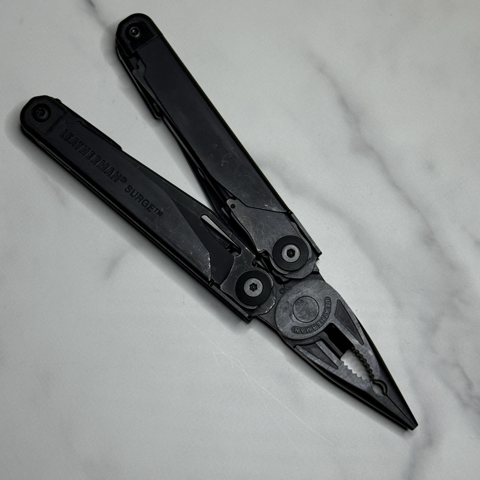 Leatherman Surge Cap Crimper Black Multitool w/Molle Sheath. Discontinued