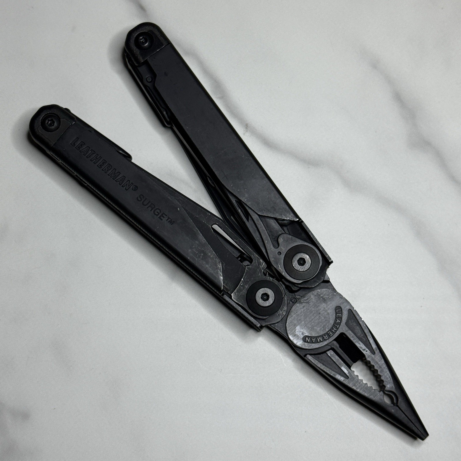 Leatherman Surge Cap Crimper Black Multitool w/Molle Sheath. Discontinued