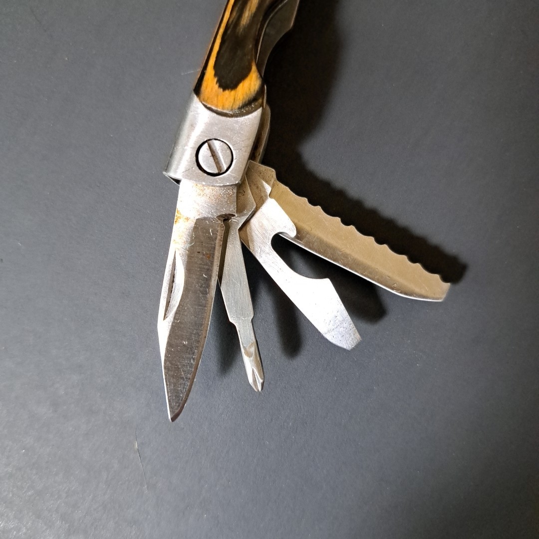 Multi tool With Laminated Wood Handles, Clean
