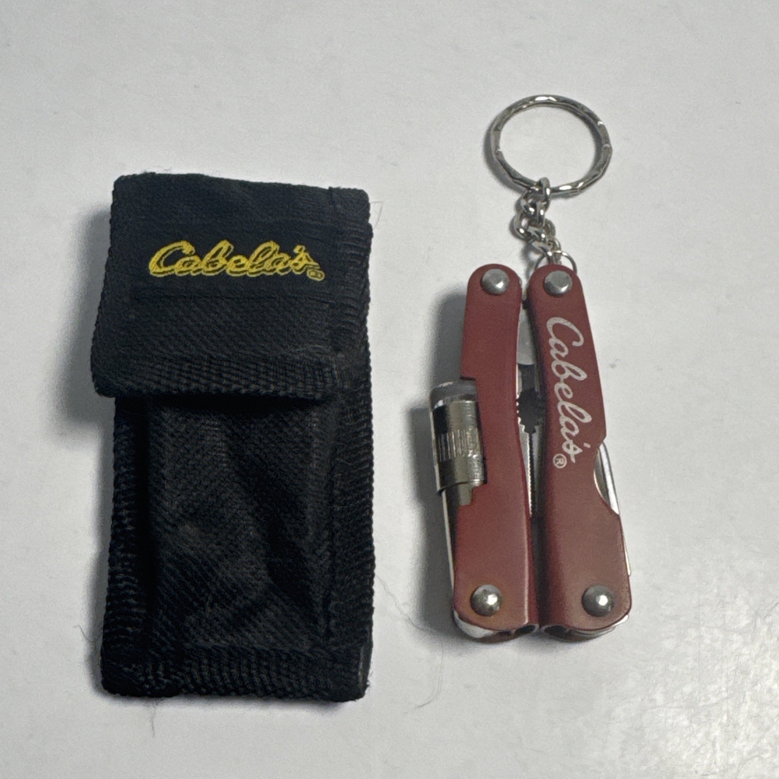 Cabelas Pocket Multi-Tool Flashlight Serrated Knife Can Opener Key chain Pliers