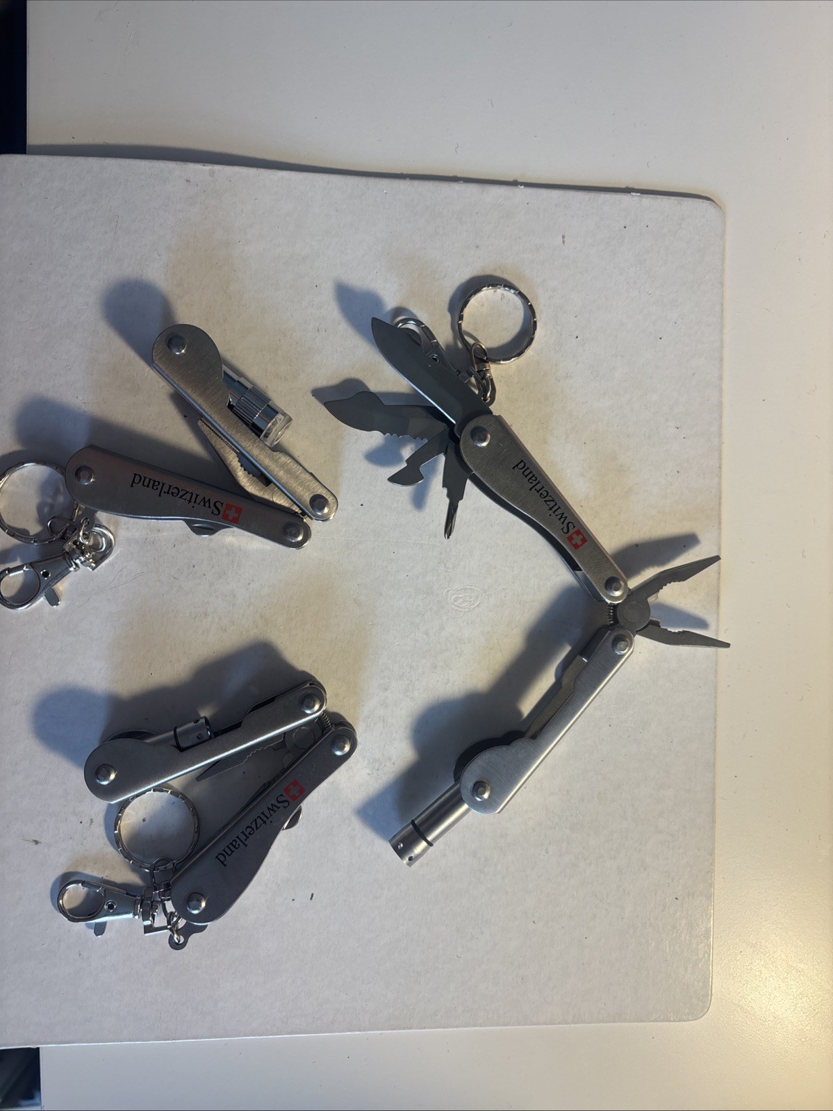 Multi tool folding Knives, pliers/light From Switzerland
