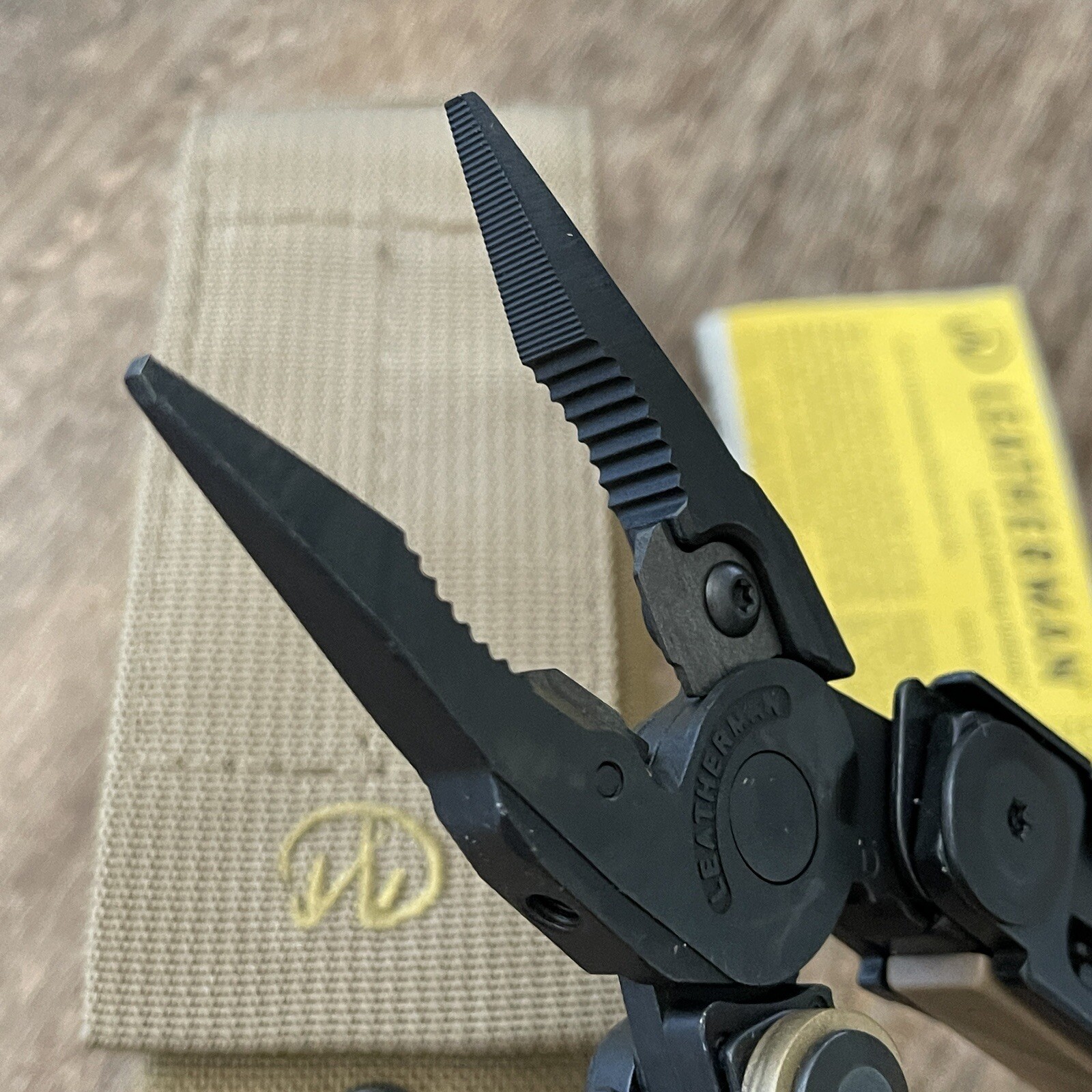 Leatherman MUT Black w/Titanium Clip multi tool, brown sheath. Made 12/2012