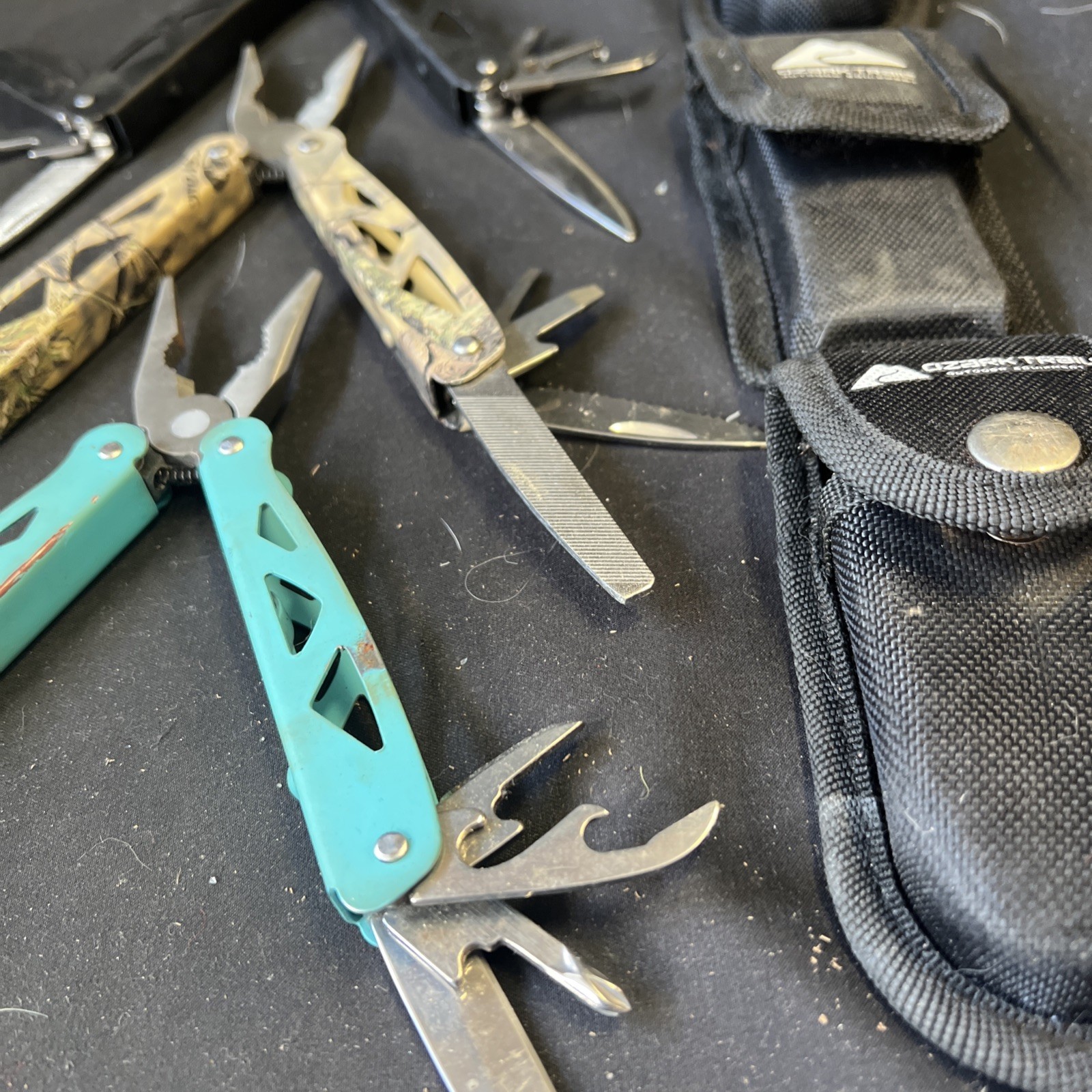 Set Of 3 Ozark Trail Trailside 12-in-1 Multitool – Black, Teal, & Camouflage