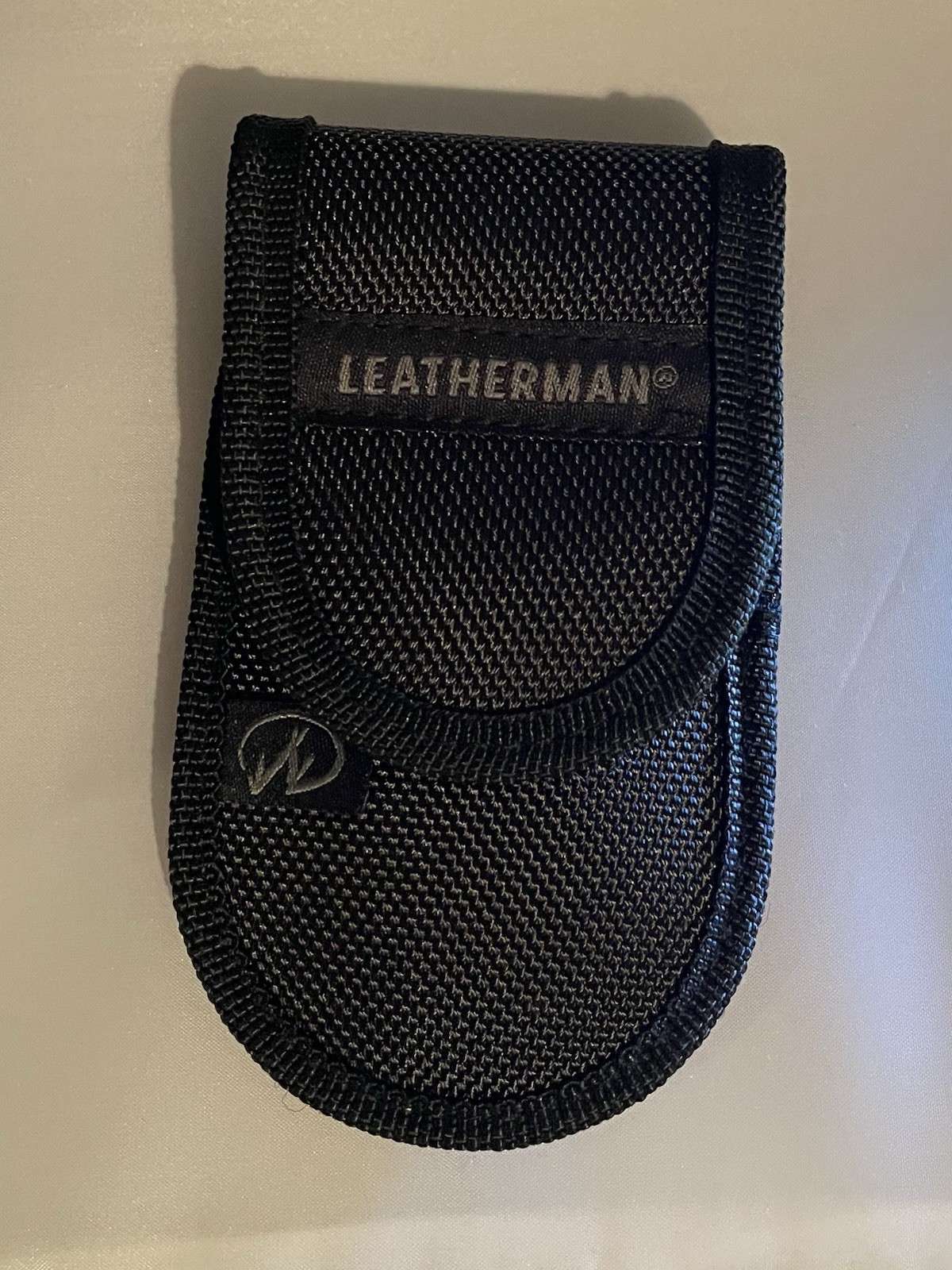 LM89 Leatherman Rev Stainless W/ Nylon Sheath
